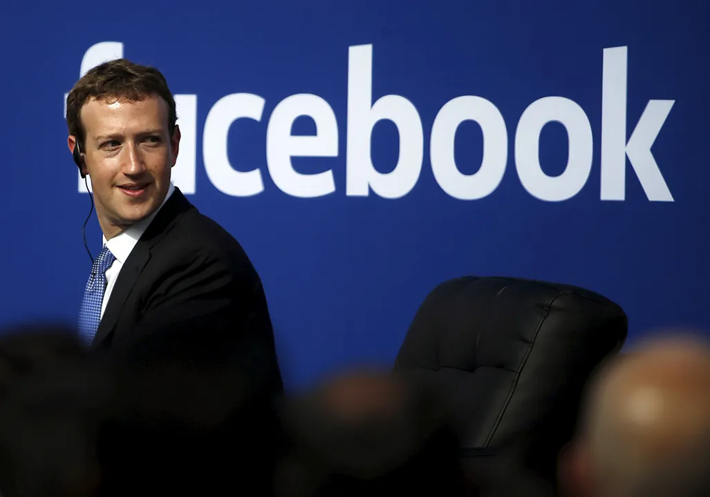  Facebook CEO Mark Zuckerberg is seen on stage during a town hall at Facebook's headquarters in Menlo Park, California September 27, 2015. Picture taken February 27, 2015.  REUTERS/Stephen Lam/File Photo - RTX2K5PB 