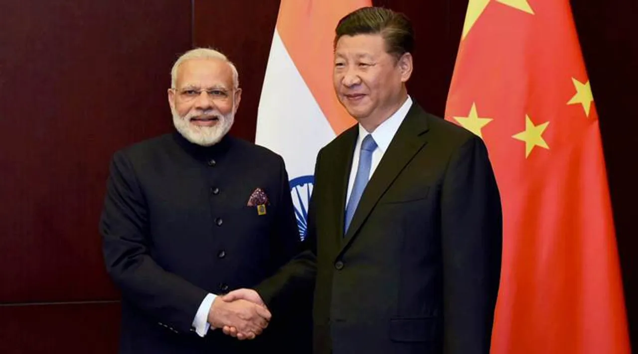  Astana: Prime Minister Narendra Modi and Chinese President Xi Jinping on the sidelines of the SCO Summit in Astana, Kazakhstan on Friday. PTI Photo (PTI6_9_2017_000052B) 