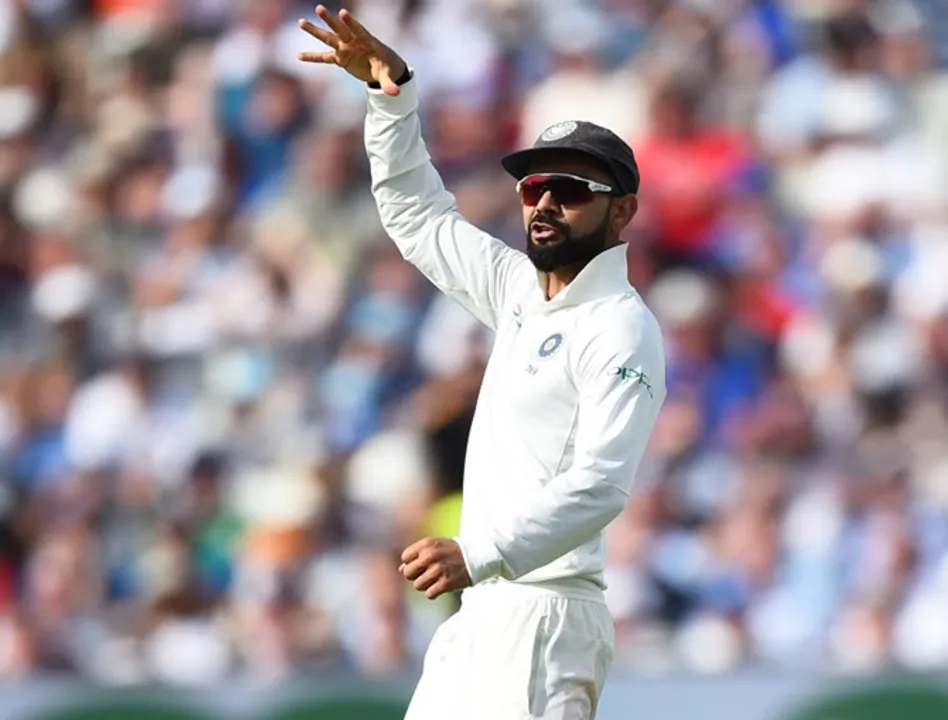  BIRMINGHAM, ENGLAND - AUGUST 01: Virat Kohli celebrates after taking the wicket of England's Joe Root during day one of the Specsavers 1st Test match between England and India at Edgbaston on August 1, 2018 in Birmingham, England. (Photo by Nathan Stirk/Getty Images) 