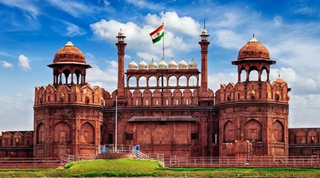  India famous travel tourist landmark and symbol - Red Fort (Lal Qila) Delhi with Indian flag - World Heritage Site. Delhi, India 