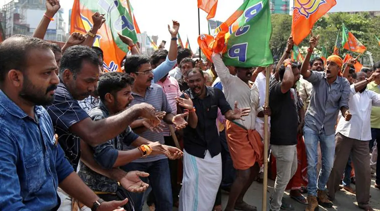  Supporters of India's ruling Bharatiya Janata Party (BJP) shout slogans as they block a highway during a protest against the arrest of their leader K Surendran, who police said was taken into preventive custody on Saturday night at Nilakkal base camp near the Sabarimala temple, in Kochi, India, November 18, 2018. REUTERS/Sivaram V 