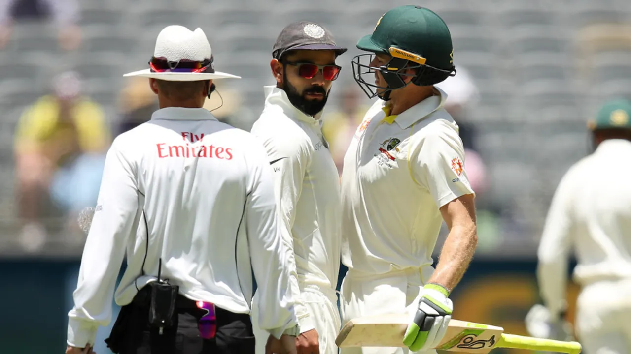  PERTH, AUSTRALIA - DECEMBER 17: Virat Kohli of India and Tim Paine of Australia bump into each other during day four of the second match in the Test series between Australia and India at Perth Stadium on December 17, 2018 in Perth, Australia. (Photo by Cameron Spencer/Getty Images) 