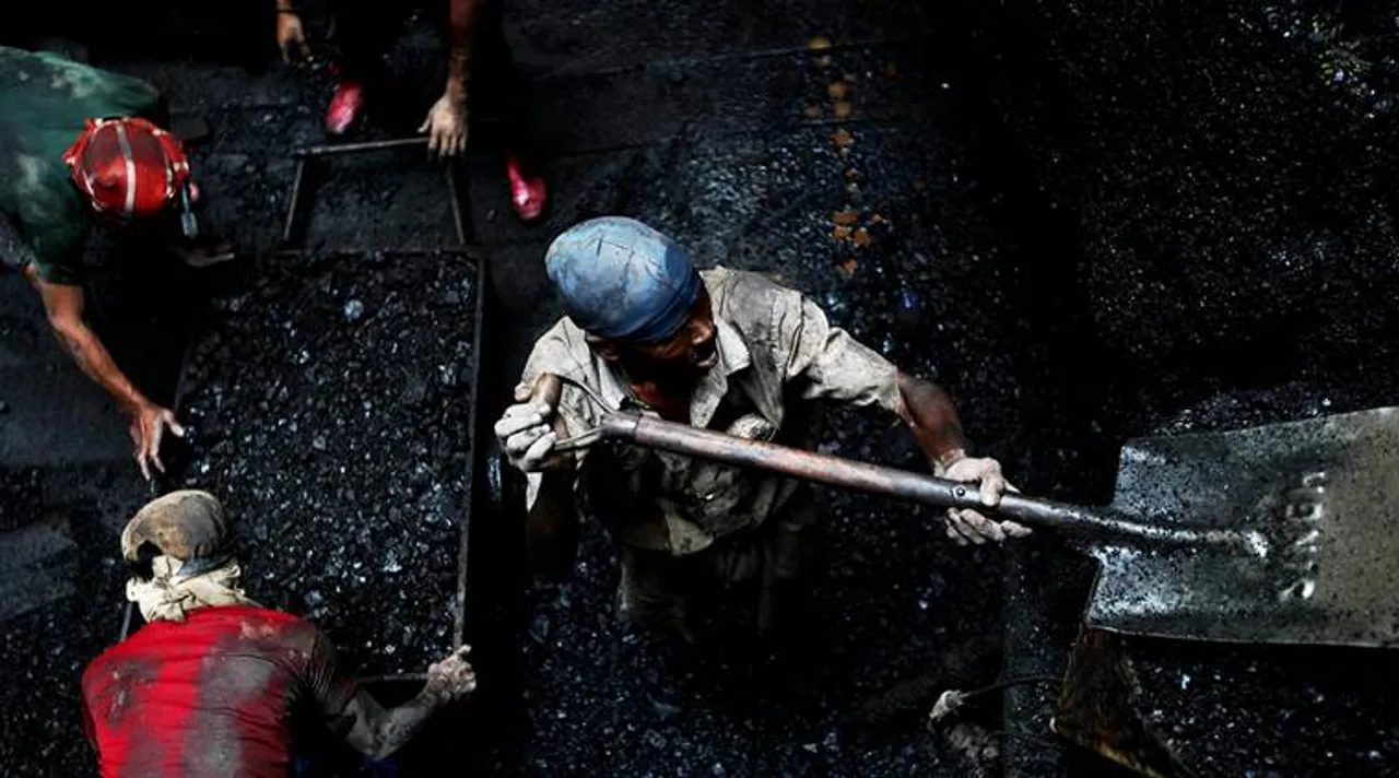  Coal workers digging for coal in a seventy feet deep rathole mine in the Jaintia Hills in Meghalaya. Express Photo by Tashi Tobgyal New Delhi 281012 