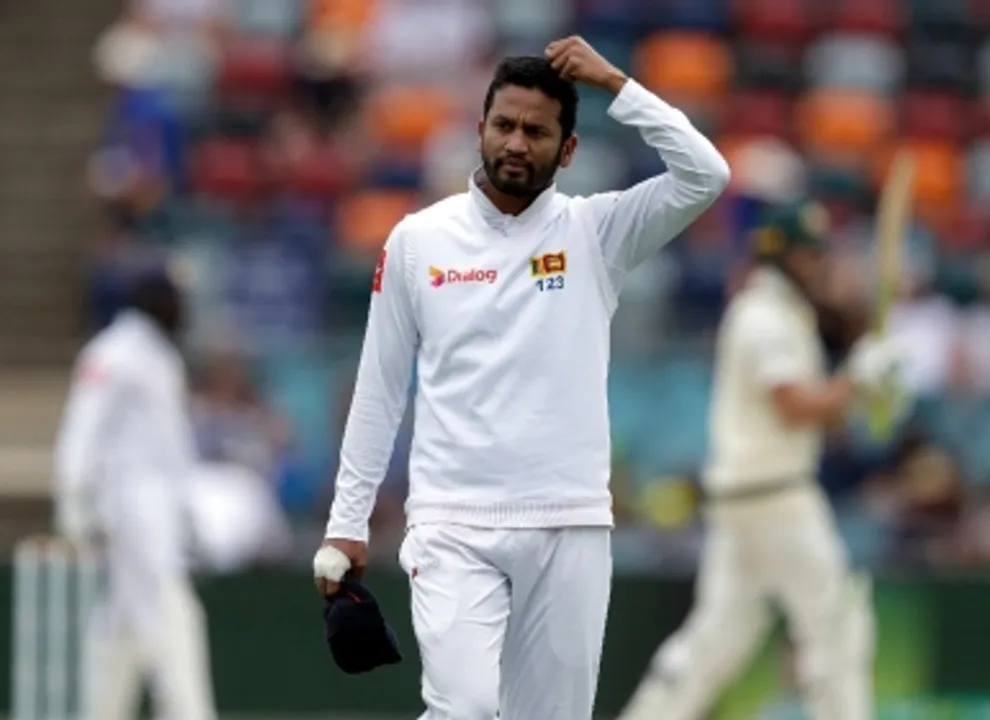  Sri Lanka's Dimuth Karunaratne scratches his head on day 2 of their cricket test match against Australia in Canberra, Saturday, Feb. 2, 2019. (AP Photo/Rick Rycroft) 
