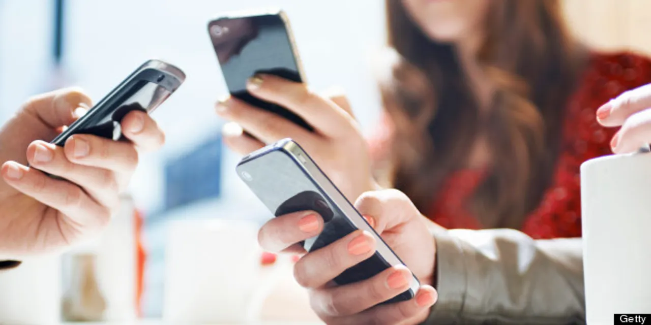  hands texting with mobile phones in cafe 