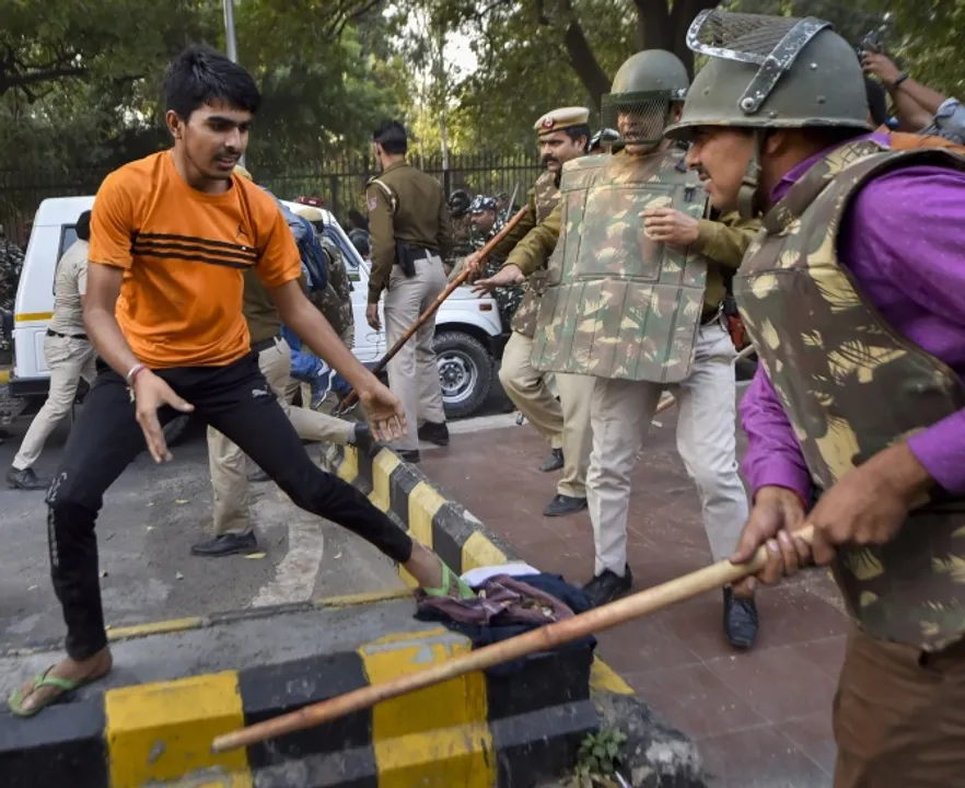  **EDS: RPT WITH DATE CORRECTION**New Delhi: Jawaharlal Nehru University students are baton charged by police during a protest march towards Parliament, on the first day of the Winter Session, demanding a total rollback of the hostel fee hike, in New Delhi, Monday, Nov. 18, 2019. The students, who were holding a protest on the university's premises for the last three weeks, hit the streets seeking to get the attention of Parliament about their demands, asserting they will not relent until the government withdraws the hike. (PTI Photo/Ravi Choudhary)(PTI11_18_2019_000154B) 
