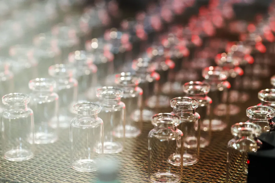  Glass vials move along a production line conveyor at the Gerresheimer AG medical glassware factory in Buende, Germany, on Tuesday, Aug. 11, 2020. Gerresheimer has built up capacity and most of its factories are operating around the clock as the company holds talks with pharma companies, working on a coronavirus vaccine. Photographer: Alex Kraus/Bloomberg 