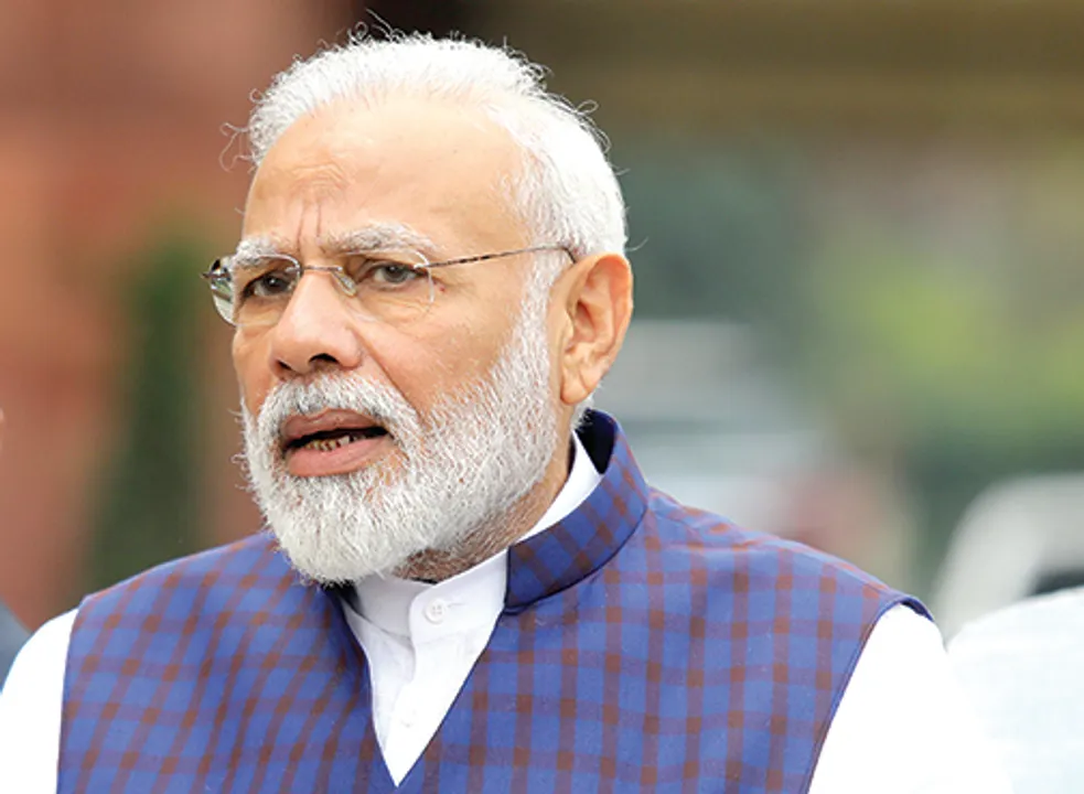  FILE PHOTO: India's Prime Minister Narendra Modi speaks to the media inside the parliament premises on the first day of the winter session in New Delhi, India, November 18, 2019. REUTERS/Altaf Hussain/File Photo 