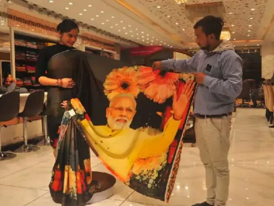 ଉତ୍ତରପ୍ରଦେଶରେ ବିଜେପି ବାଣ୍ଟିବ ମୋଦୀ ଓ ଯୋଗୀଙ୍କ ଫଟୋ ଥିବା ୨ ଲକ୍ଷ ଶାଢ଼ି