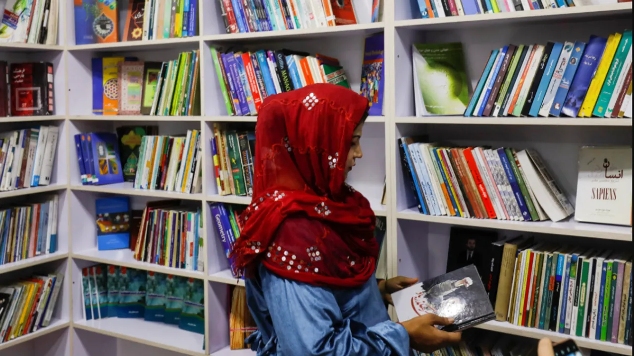 afghanistan woman books reading library