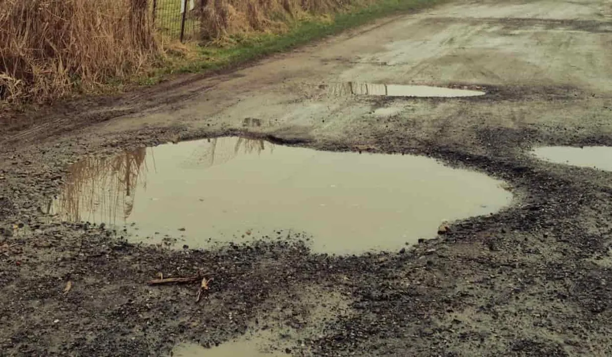 Teenager Repairs Pothole