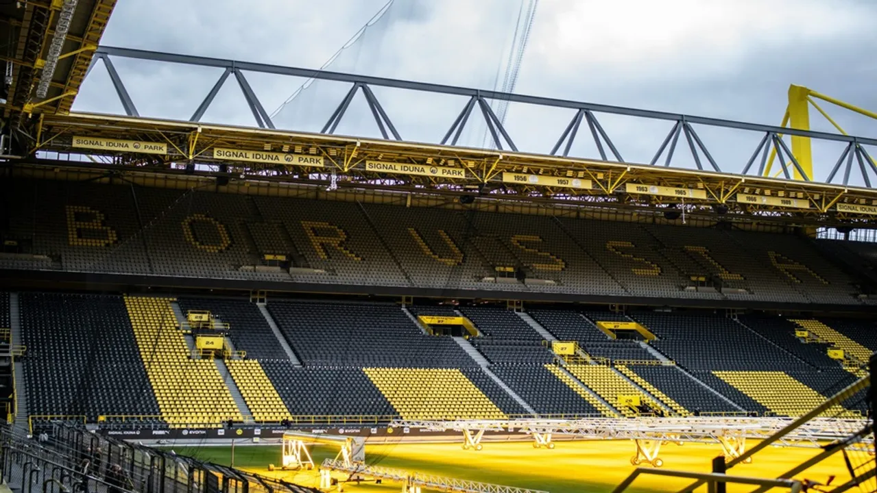  The 4 GWh solar system on SIGNAL IDUNA PARK has sparked debate over balancing climate impact with ethical sourcing. Image Source: ESMC Solar 