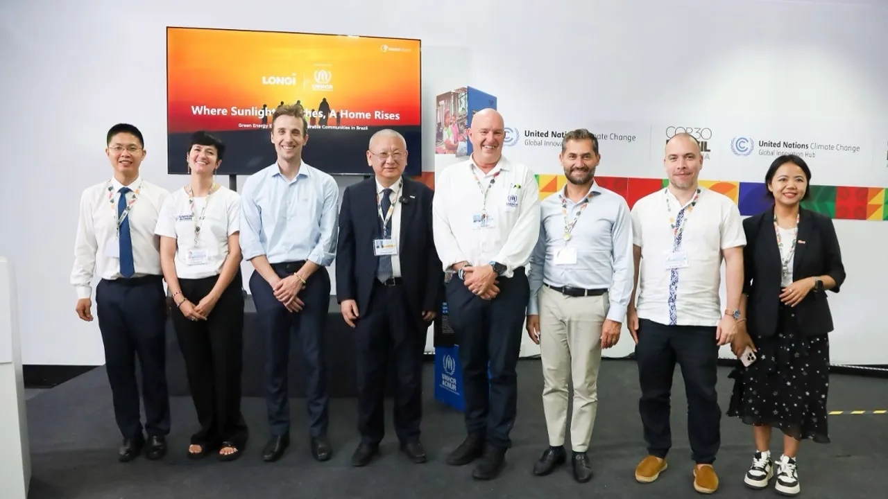  UNHCR collaborators and LONGi representatives celebrate the launch of community BC infrastructure. Image Source: LONGi 