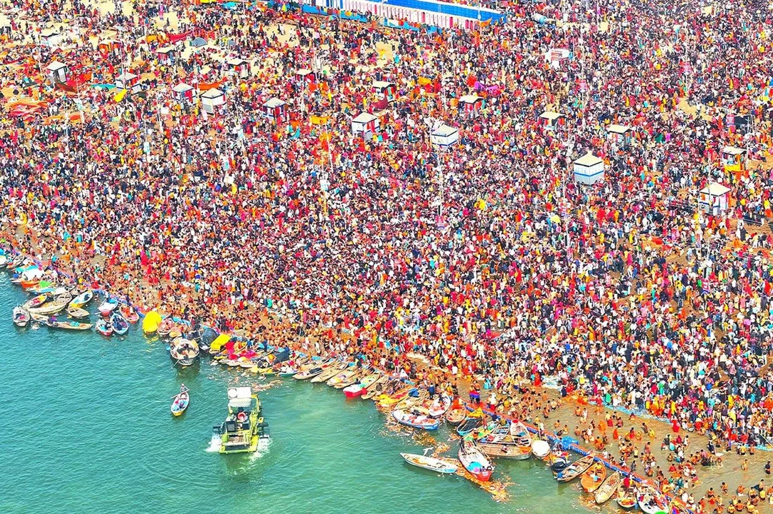  PRAYAGRAJ, JAN 28 (UNI):- Devotees taking holy dip in Sangam during the ongoing Mahakumbh Mela-2025, in Prayagraj on Tuesday. UNI PHOTO-10U 