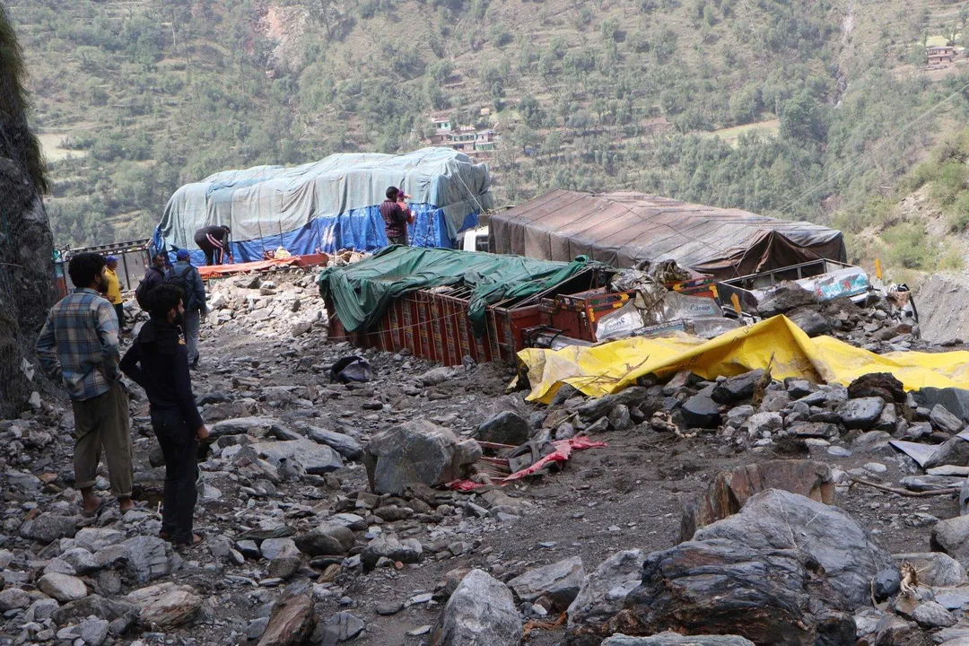  RAMBAN APRIL 21 (UNI) : Vehicles buried under the debris at Ramban on Srinagar-Jammu National Highway after cloudbursts on Monday caused flash floods that damaged huge property besides leaving several people dead and wrecks havoc in the district.UNI PHOTO-14U 