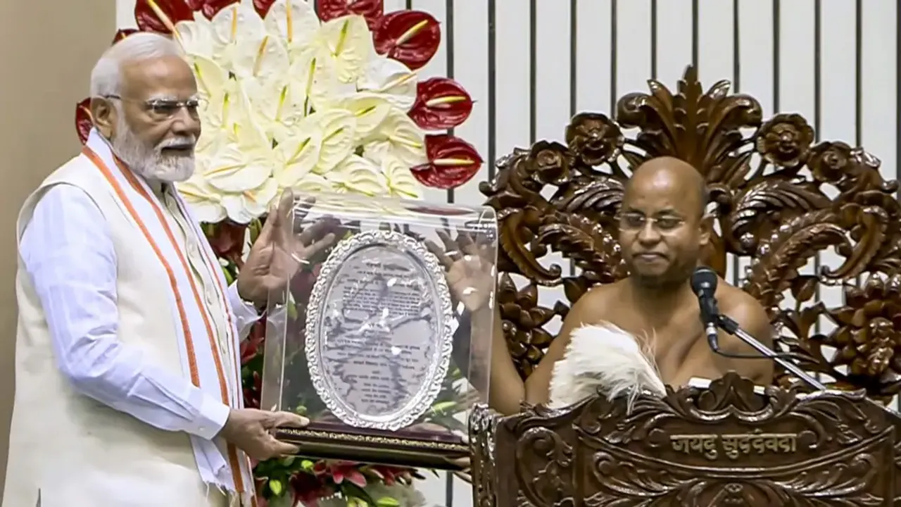  pm-modi-releases-stamp-and-coin-on-acharya-vidyanand-centenary 