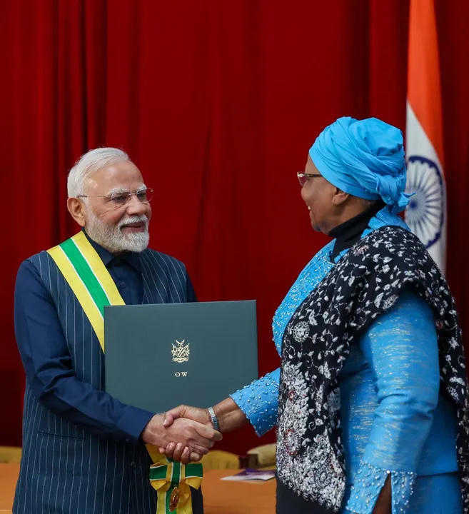  WINDHOEK, JULY 9 (UNI):-Prime Minister Narendra Modi receiving the Namibias highest honour  Order of the Most Ancient Welwitschia Mirabilis by the President of Namibia, Netumbo Nandi-Ndaitwah at Windhoek, in Namibia  on Wednesday. UNI PHOTO-42F 