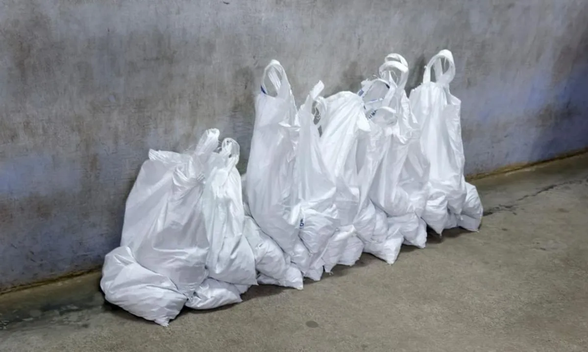  Bags of coins were brought by the divorce applicant to the Additional Family Court in Coimbatore on Wednesday. Photograph: (The Hindu) 