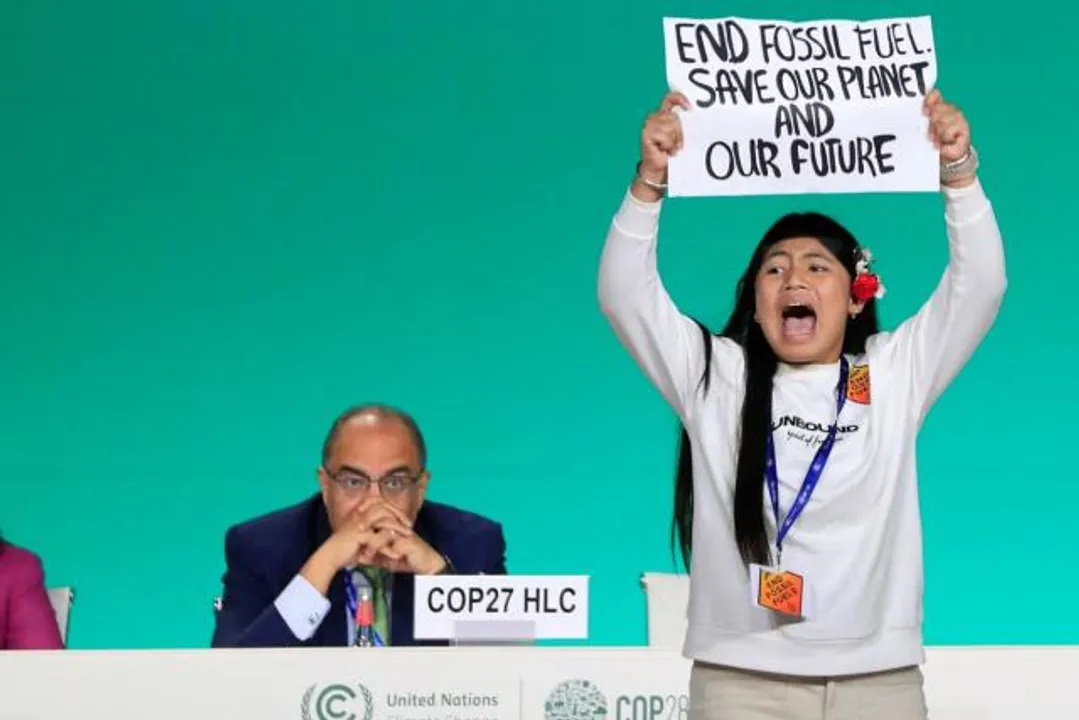  Indian girl climbs COP28 stage and screams, "End Fossil Fuels"