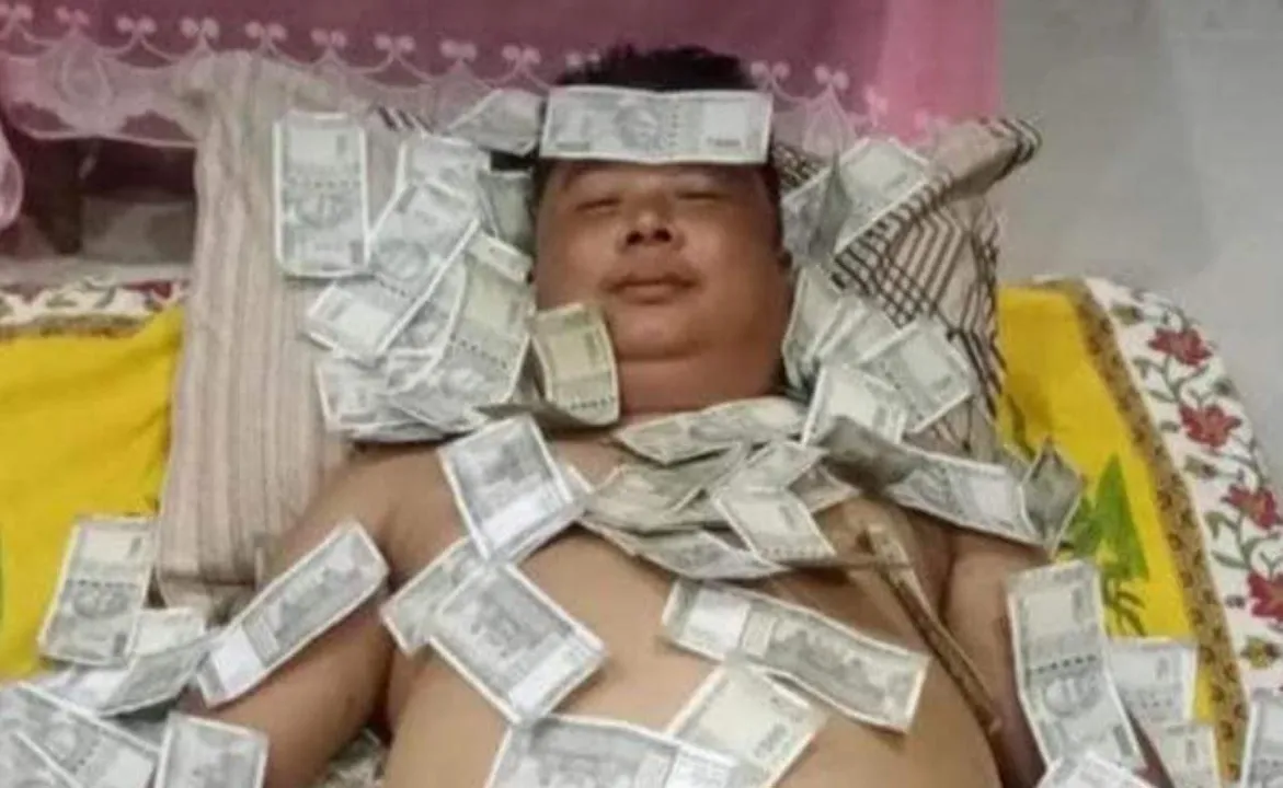  Corruption-accused Assam politician seen sleeping on bed of notes
