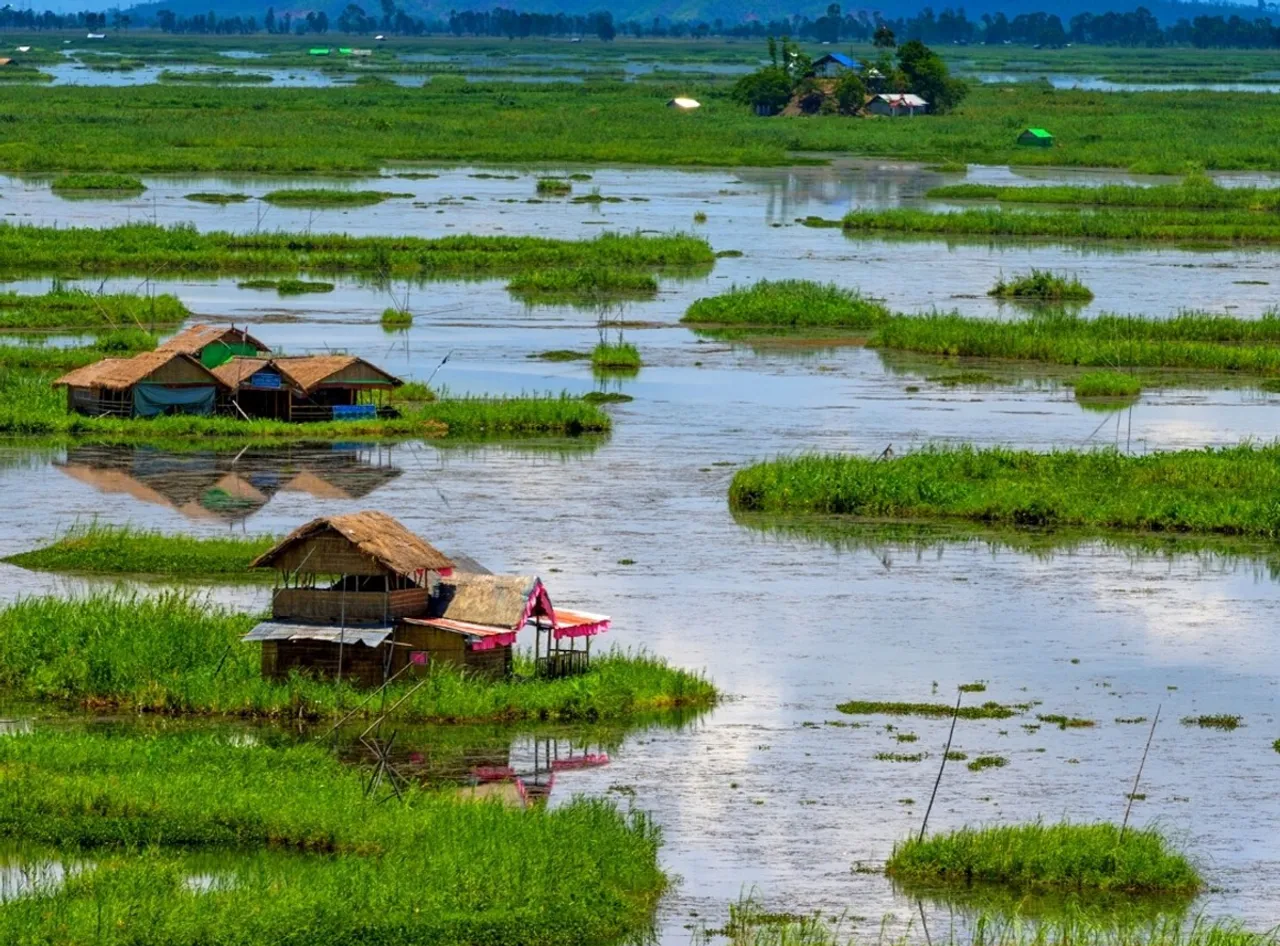 Bamboo huts (phumsang) built on the floating islands of Loktak Lake in Moirang, Manipur
