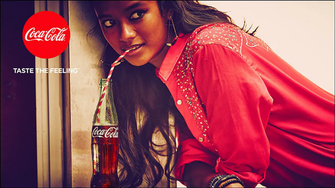 Coca-Cola replaces 'Open Happiness' with 'Taste the feeling'