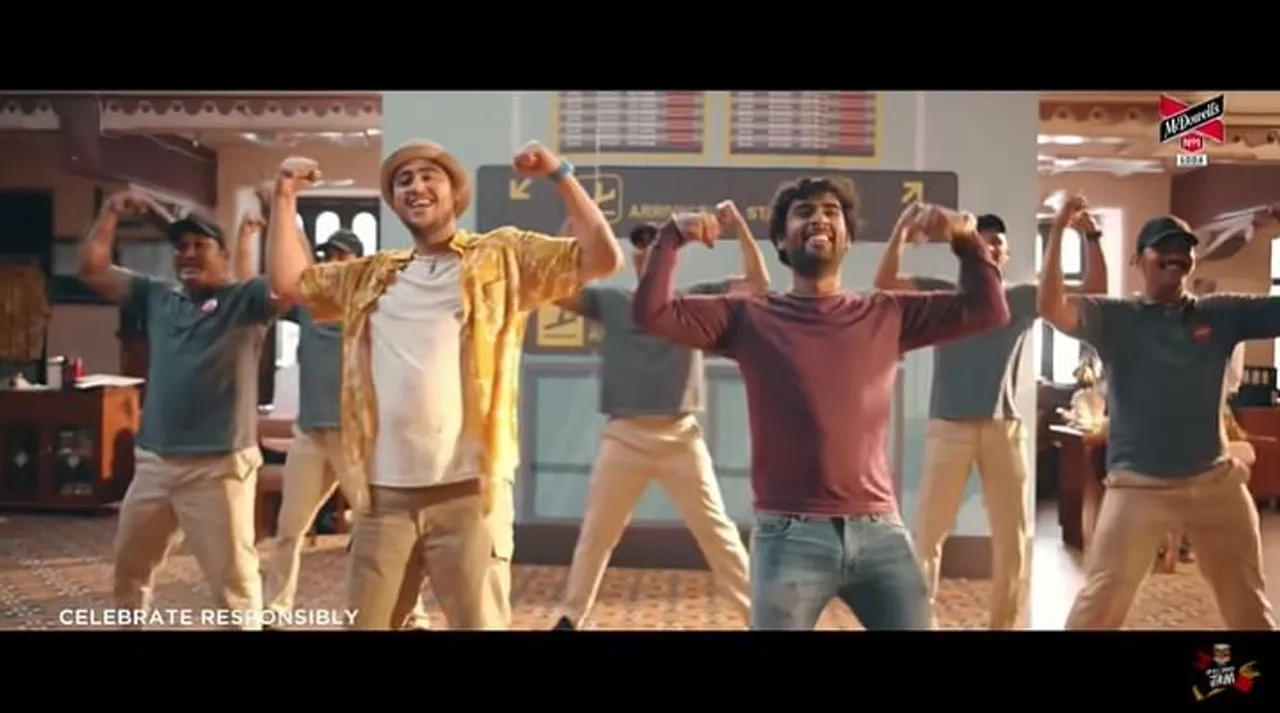 McDowell’s No.1 belts out a song and dance number among friends to urge folks to get the jab