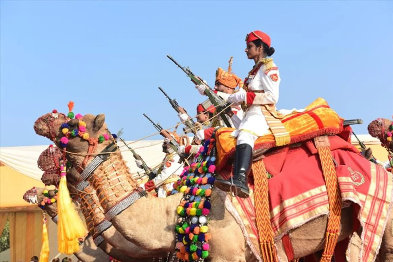 Female guards dressed in royal attire at the famous BSF Camel Contingent