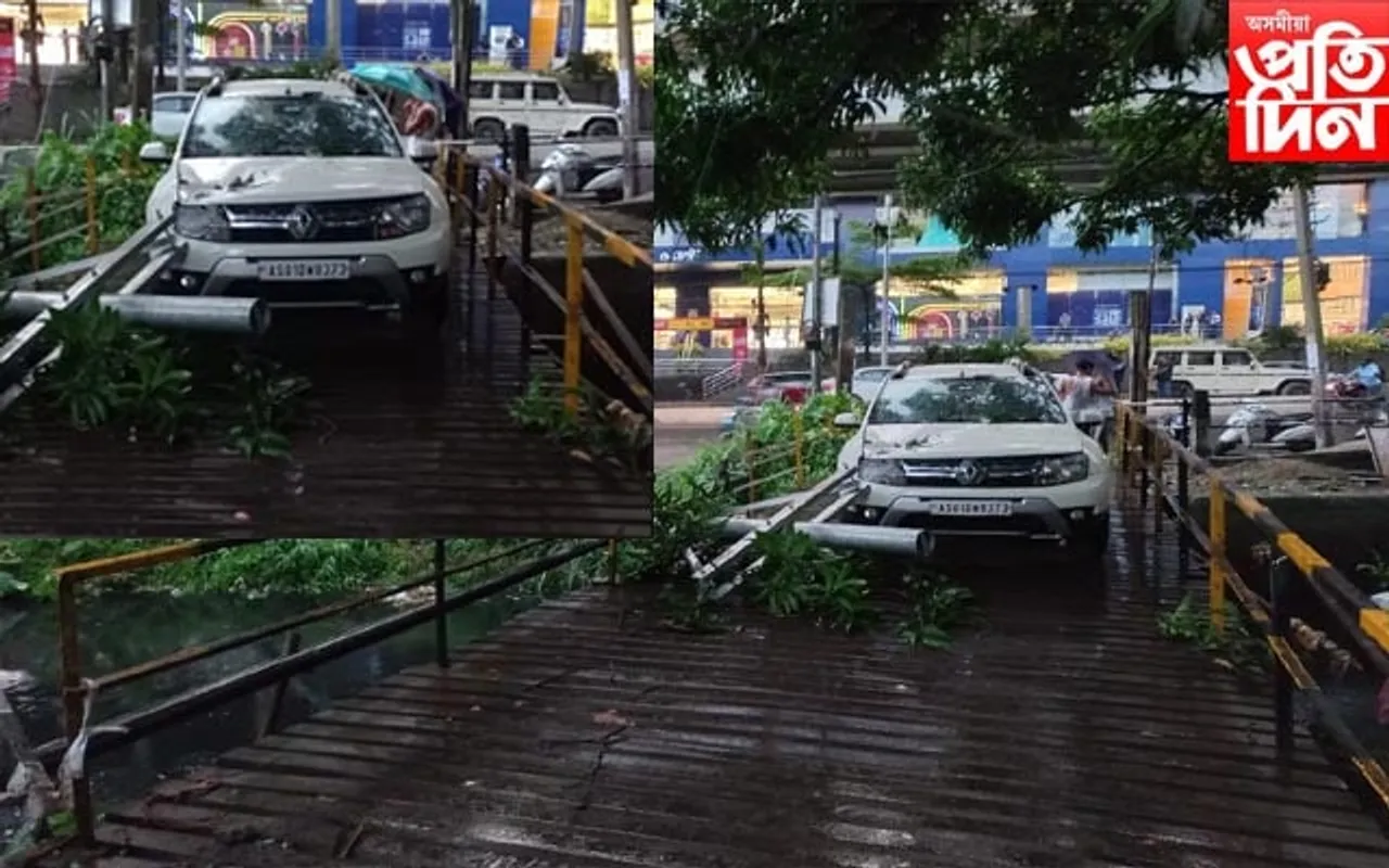 মহানগৰীত ভয়ংকৰ কাণ্ডঃ গাড়ীৰ ওপৰত বাগৰি পৰিল ইলেক্ট্ৰিক খুঁটা