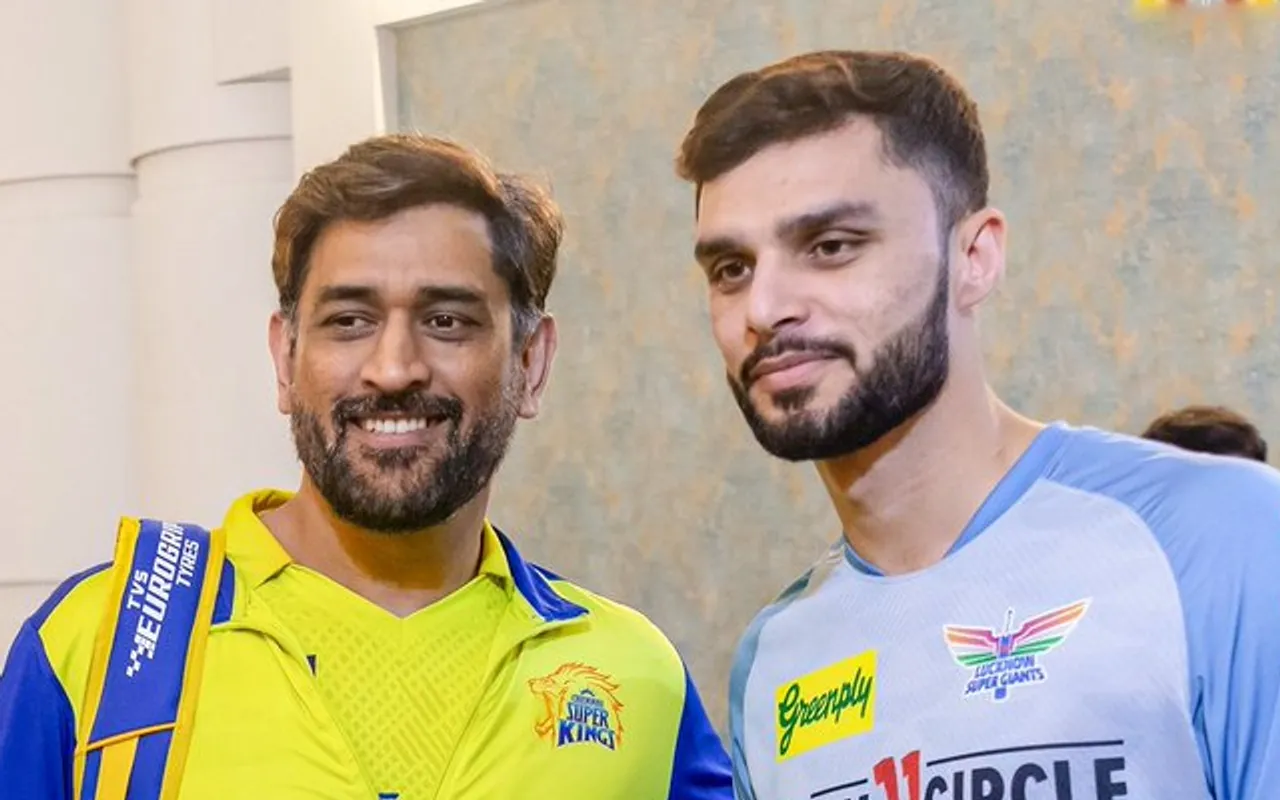 MS Dhoni with Naveen-Ul-Haq