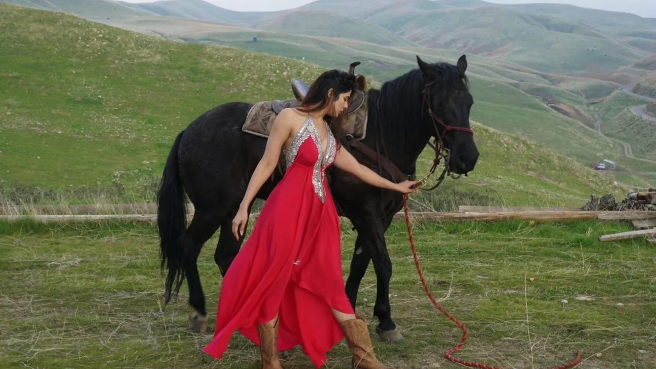 Renu Kaushal enjoys horse riding, she is looking Sexy and attractive in Red Gown