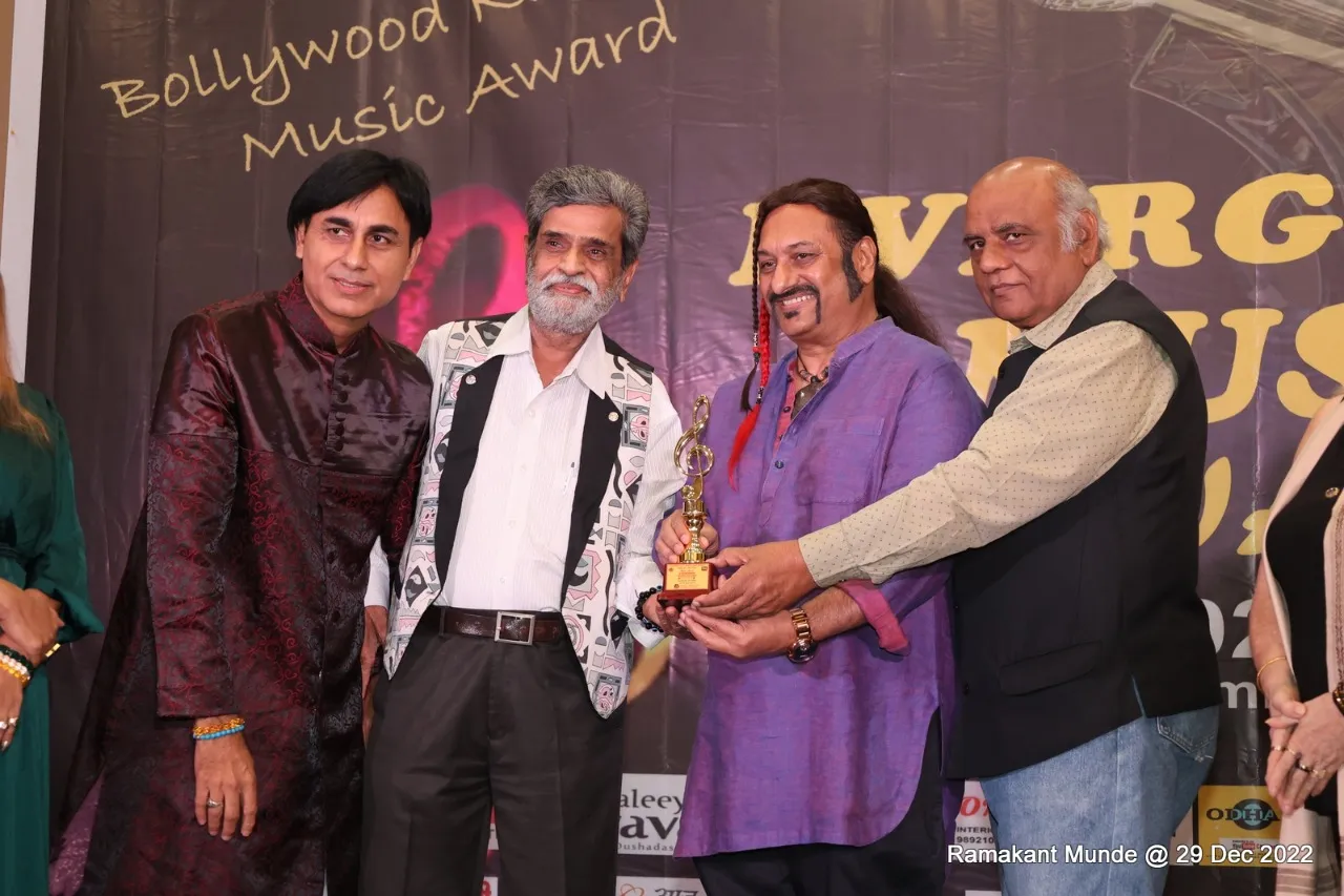 Organizer, Editor Devendra Khanna, Leslie Luice, lyricist Sudhakar Sharma at Evergreen award function.
