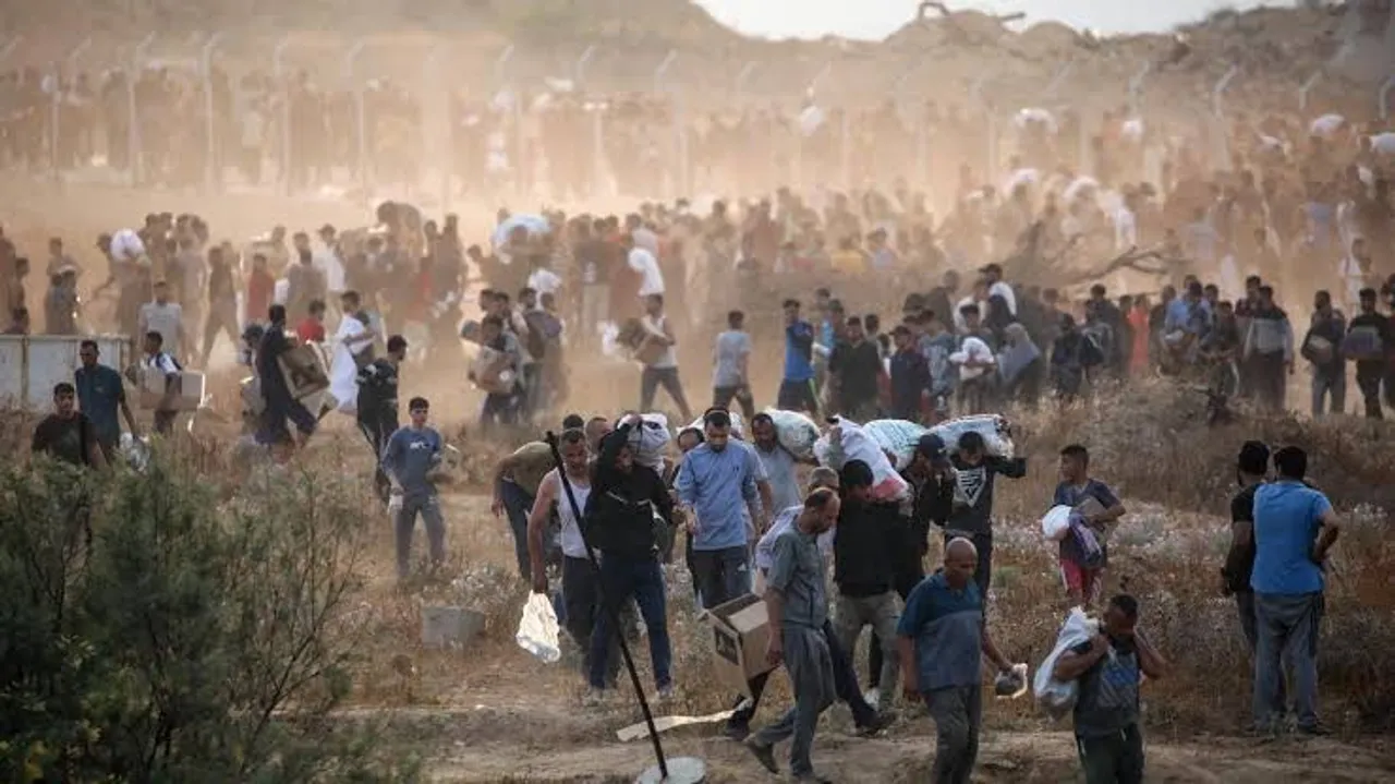 Gaza civil defence says Israeli attacks kill 26 near two aid centres