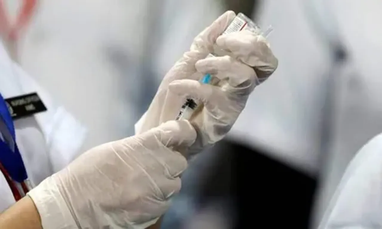 As Covid-19 cases multiply, frontline workers and seniors receive 'precautionary doses'