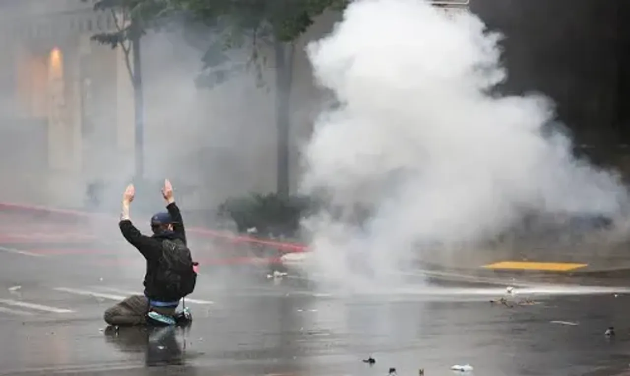 Police use tear gas against radicals protesting in Paris after election
