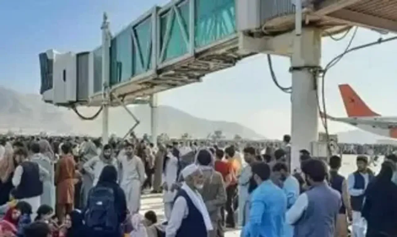 US forces fire in air to stop jostling Afghans at Kabul airport