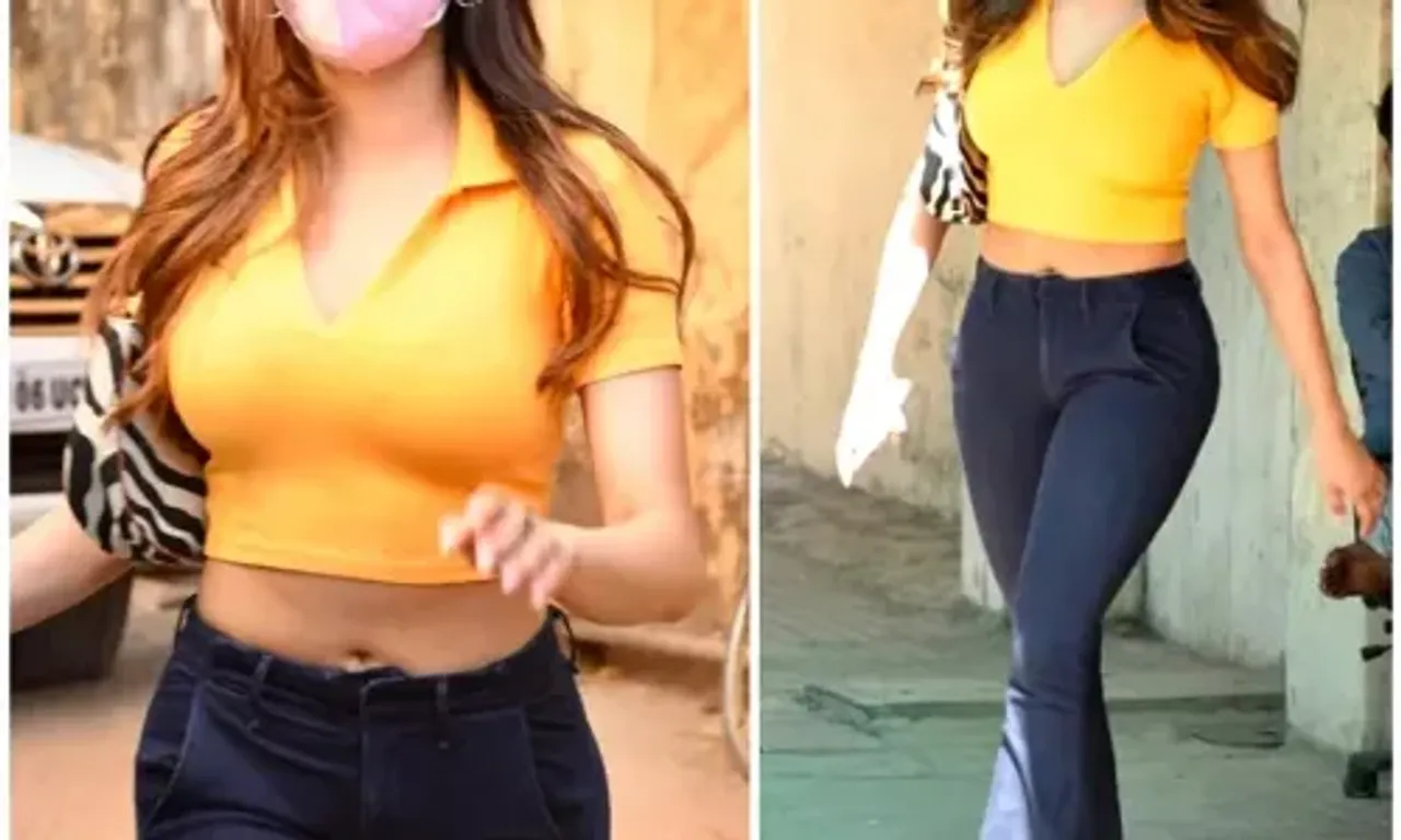 Jahanvi Kapoor keeps her OOTD simple yet bright in yellow with a crop top & bootcut jeans