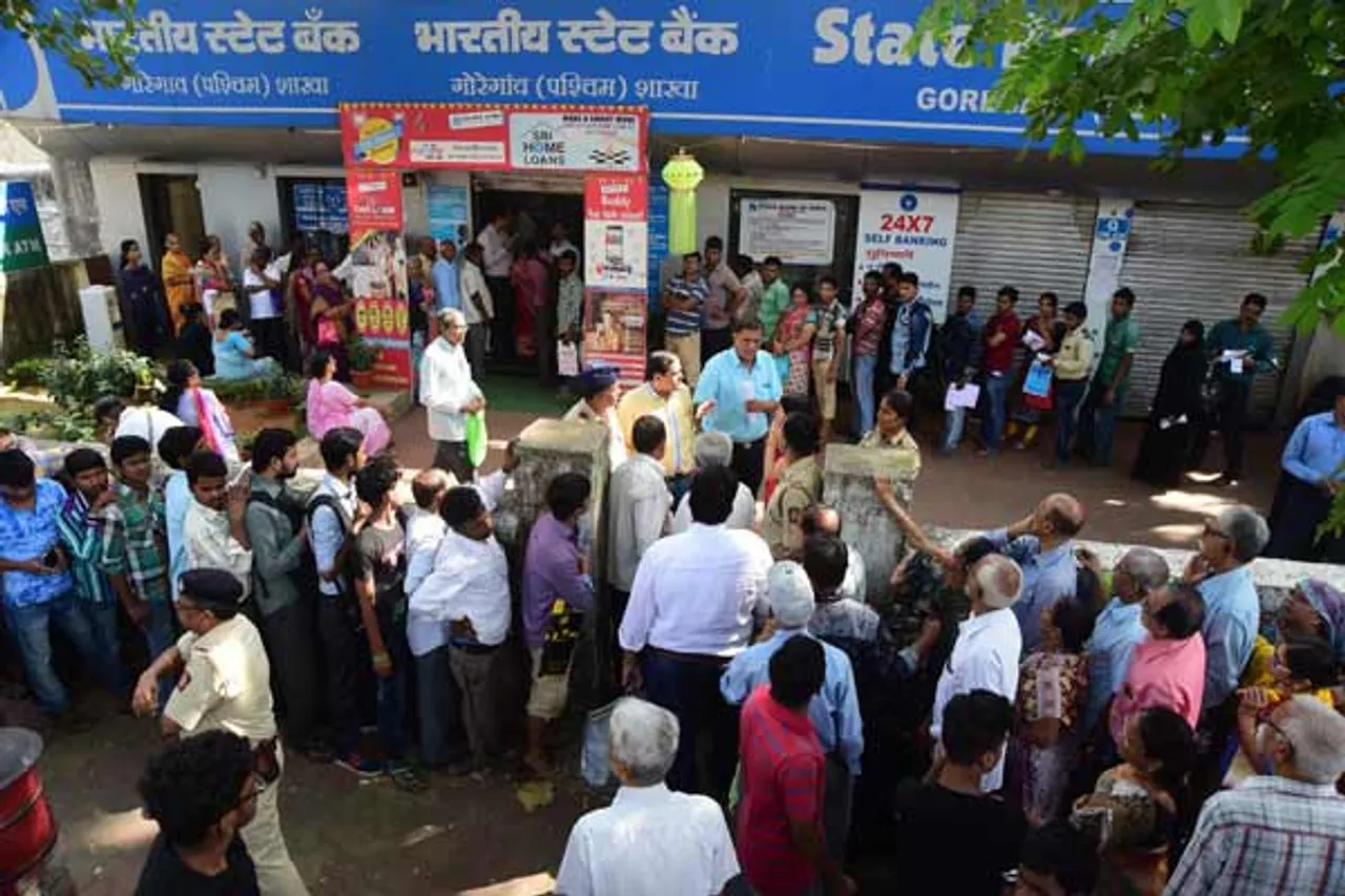 Serpentine queues, chaos outside banks on salary day