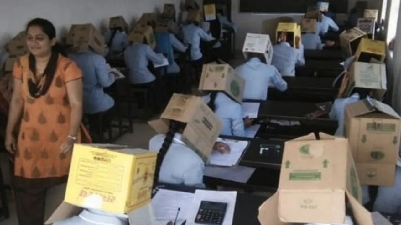 To restrict copying, Karnataka students made to write exams wearing cardboard boxes