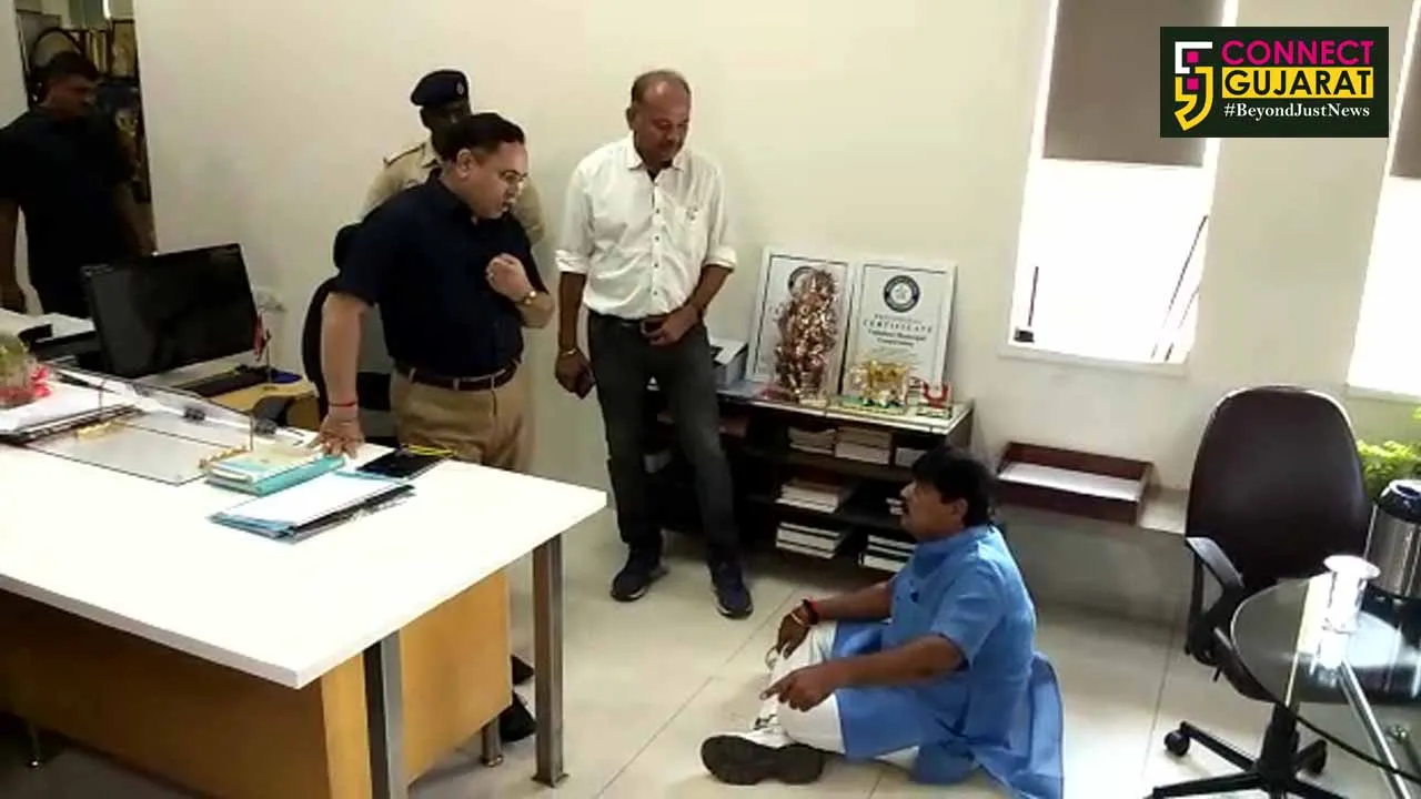 Congress Councillor Chirag Zaveri sit on floor inside VMC commissioner office