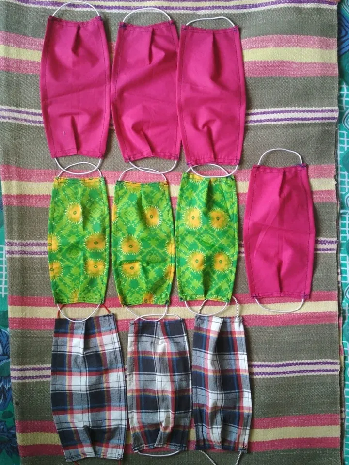 Staff members of Parul University prepare masks from unused cloths