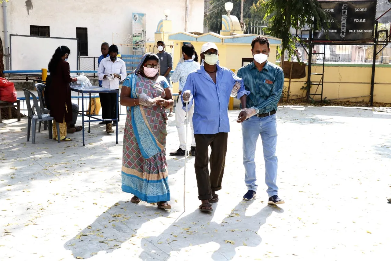 Blind voter Bharat Thakor cast his vote in Vadodara with family