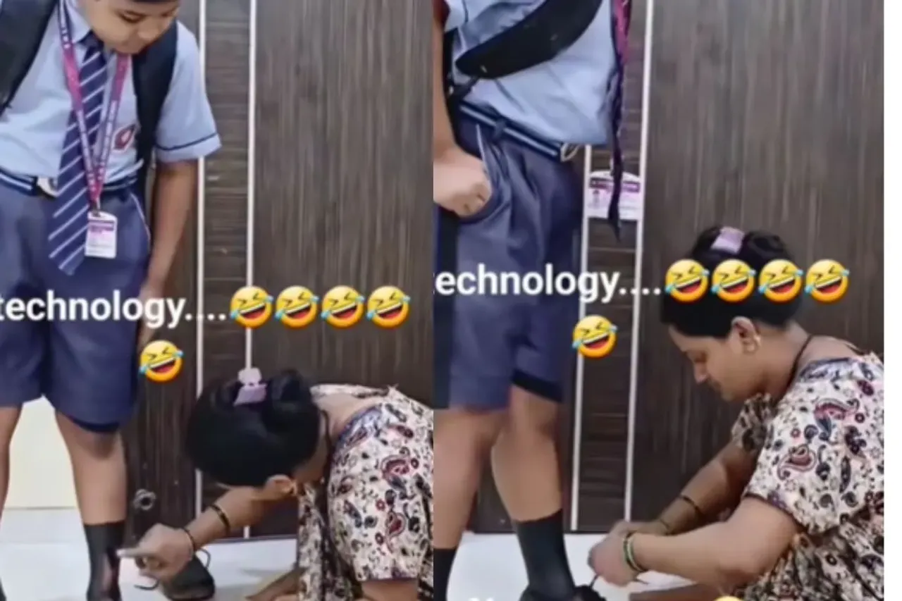 Mother applying soot on legs