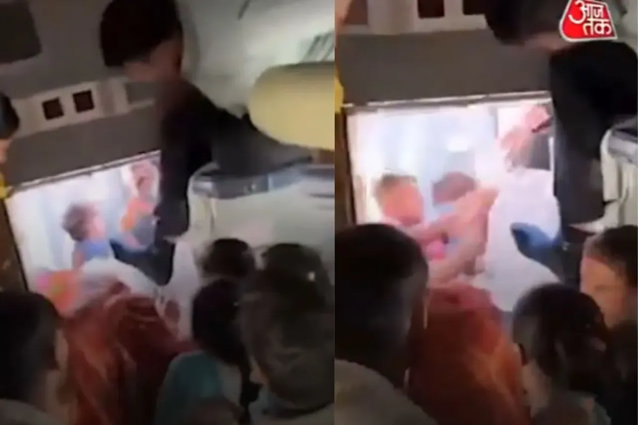 Passengers fighting with each other over a  berth 