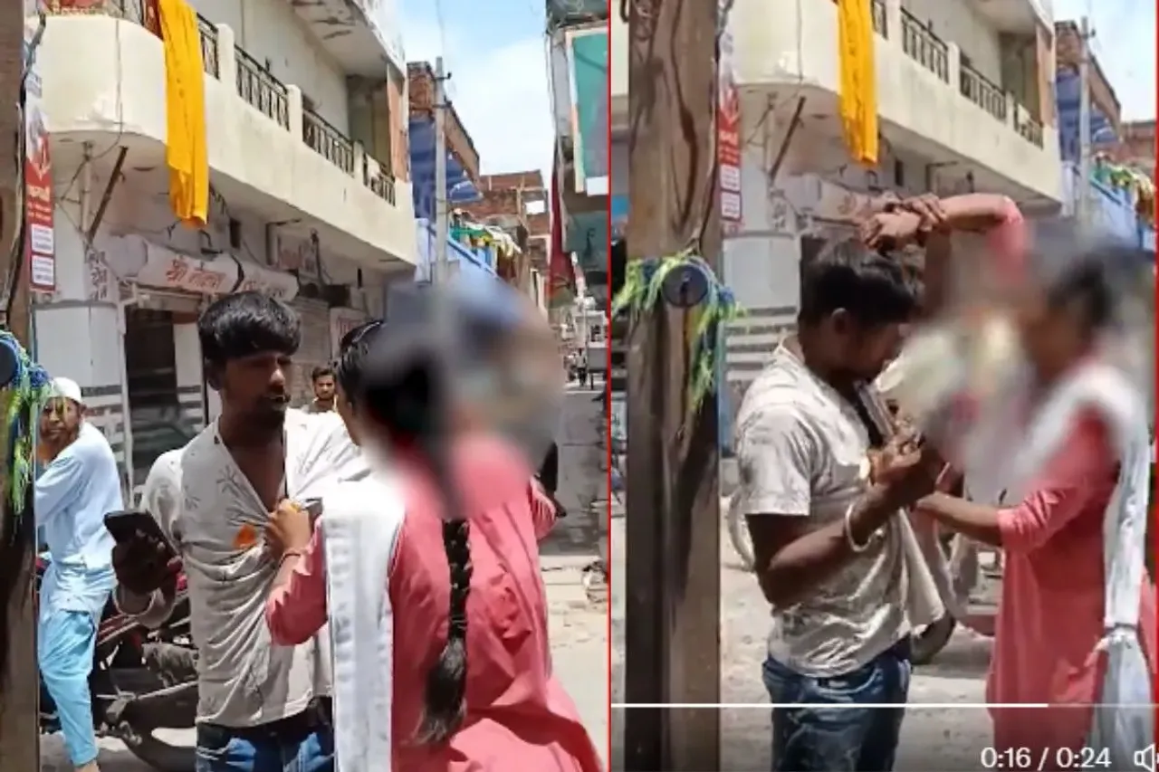 Girl beating boy with her slipper