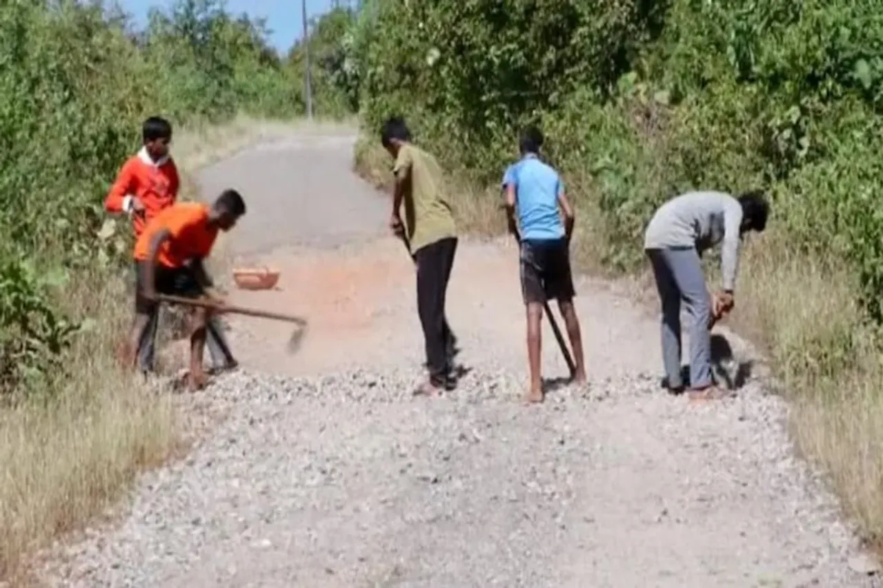 Student fill potholes