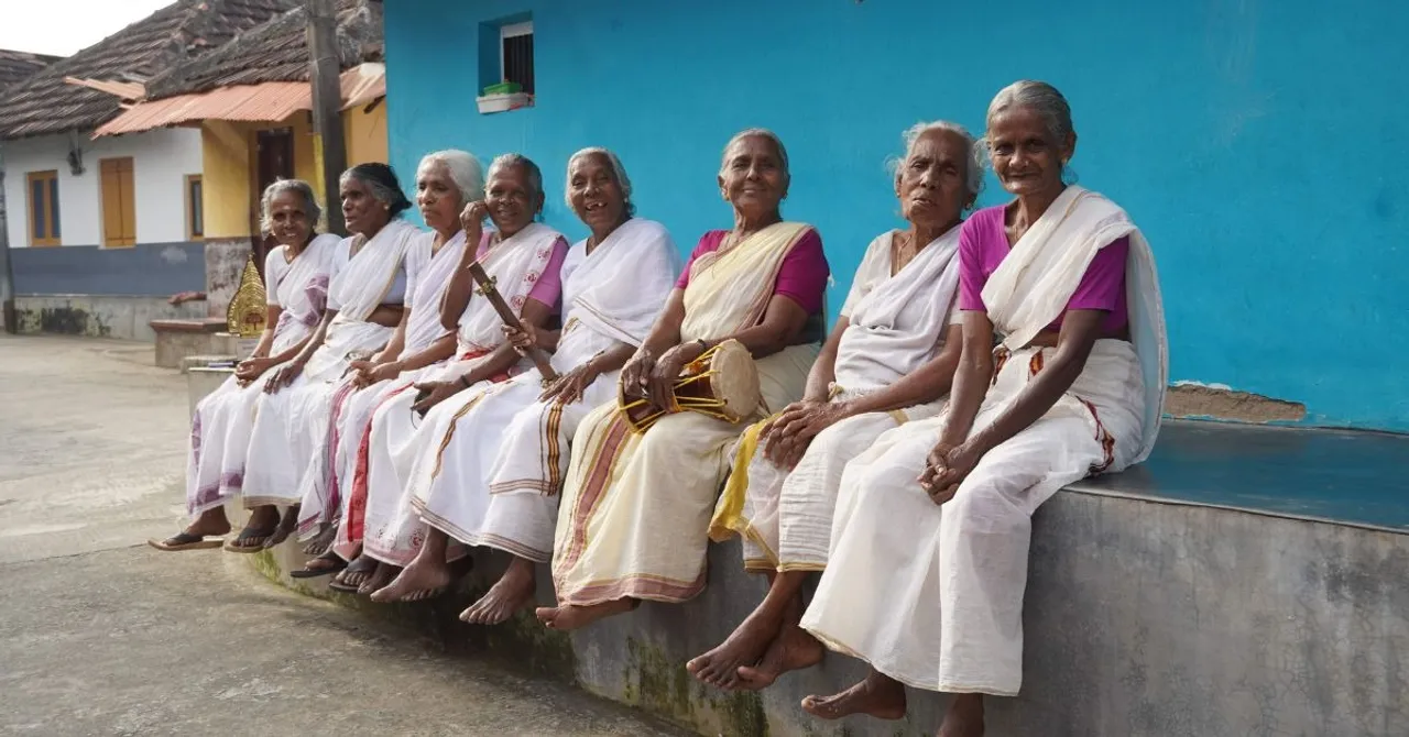 A group of elderly women singing the traditional 'Thuyilunarthu Paattu'