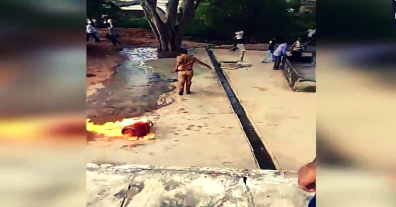 Watch: Brave UP Cop Drags Blazing Cylinder to Pond, Averts Major Tragedy!