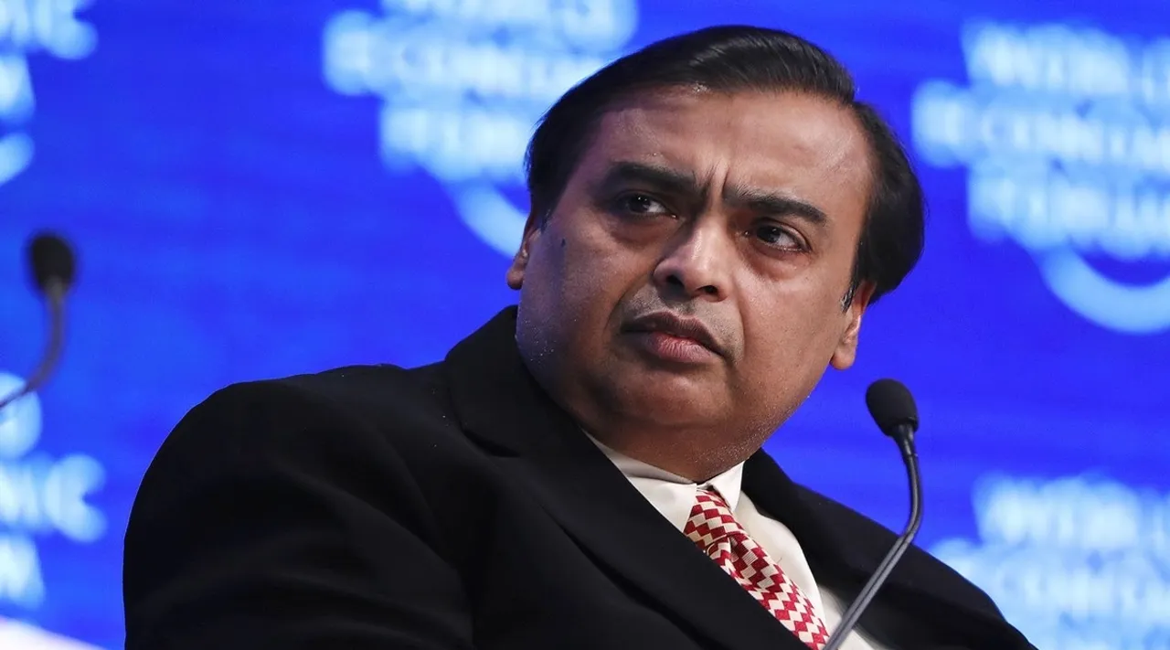 asia richest person Mukesh Ambani Reliance Industries bids for drugstore chain Boots joint bid with Apollo
