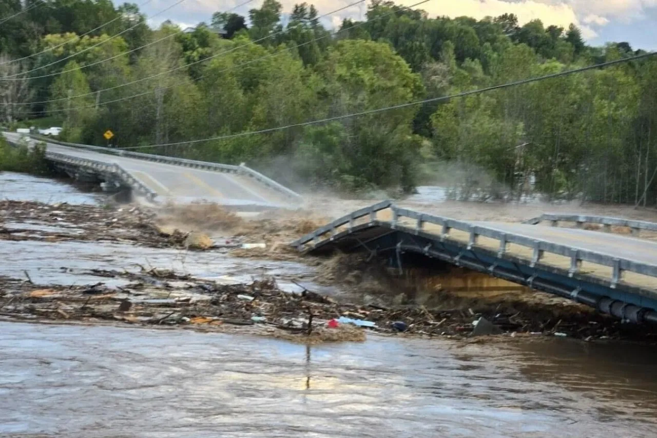 Kinser Bridge has collapsed near Greenville, Tennessee from severe flood waters of the Nolichuky 